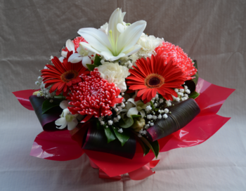 Red and white boxed flower arrangement for delivery